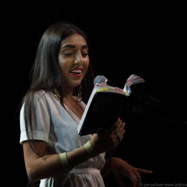 Rupi_Kaur_reading_from_her_book_milk_and_honey_in_Vancouver_-_2017